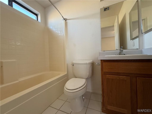 full bathroom with shower / tub combination, tile patterned flooring, toilet, visible vents, and vanity