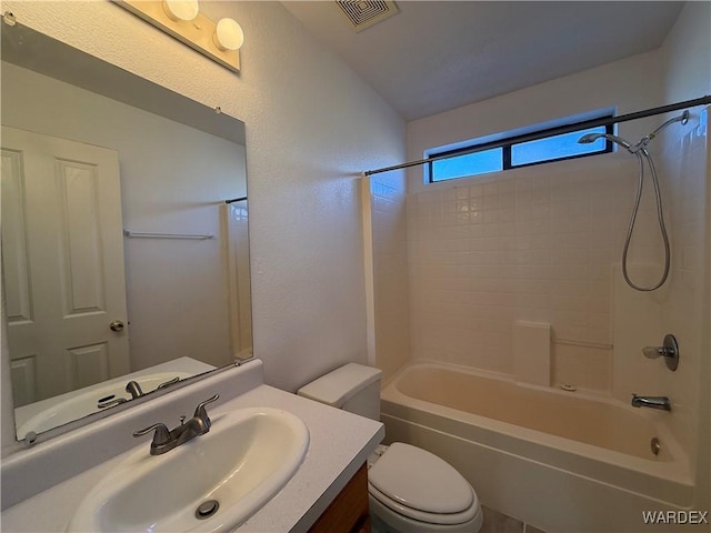 full bath featuring toilet, visible vents,  shower combination, and vanity