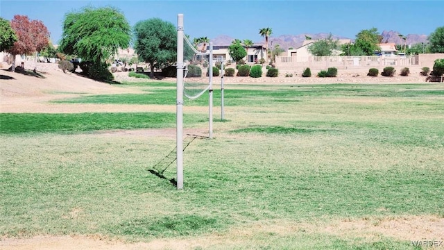 view of home's community with a yard