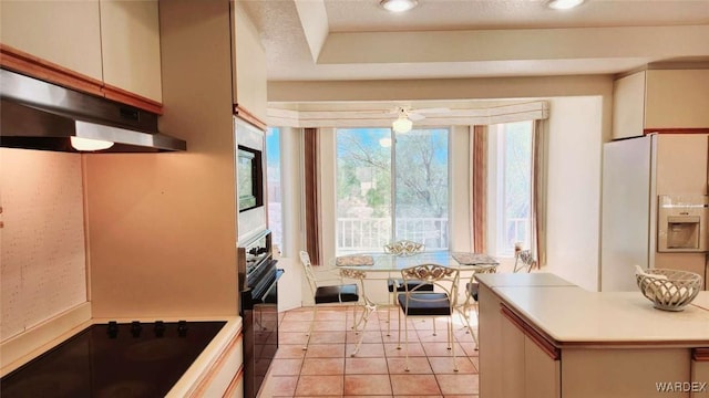 kitchen with light countertops, black appliances, recessed lighting, and white cabinets