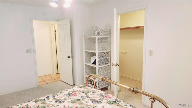 bedroom featuring light colored carpet