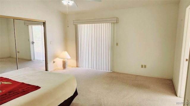 bedroom with a closet and light colored carpet