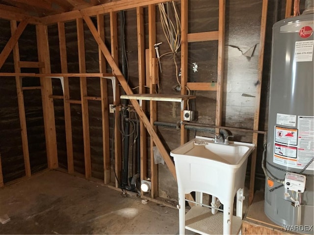 interior space featuring a sink and gas water heater