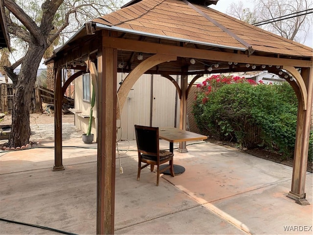 exterior space with a gazebo and fence