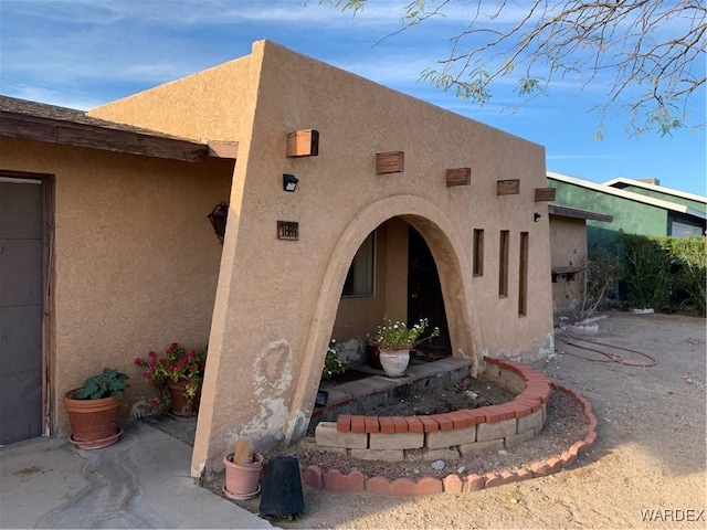 exterior space with stucco siding