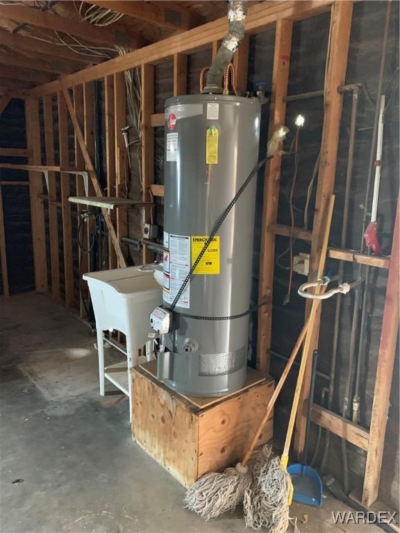 utility room featuring water heater