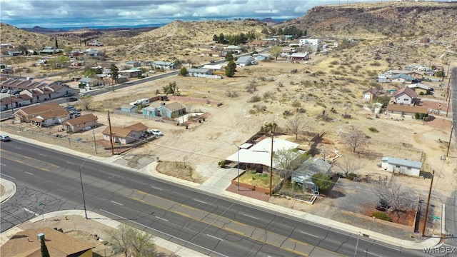 drone / aerial view featuring a residential view and a mountain view