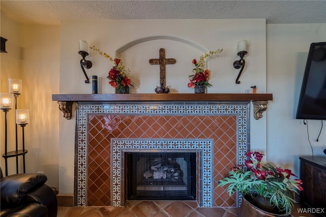 room details with a textured ceiling and a tiled fireplace