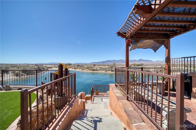 view of home's community with a pergola and a water and mountain view