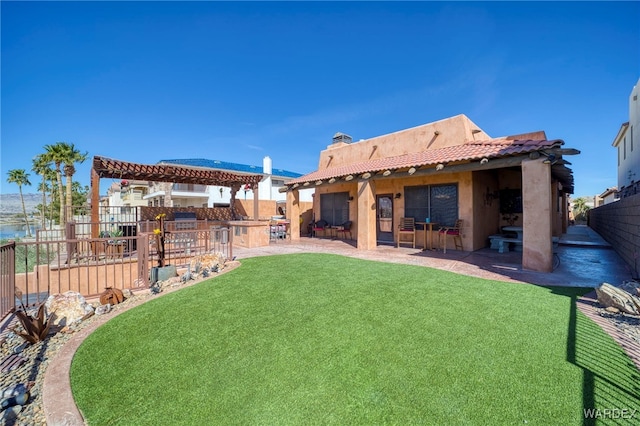 view of yard featuring a patio, fence, and a pergola