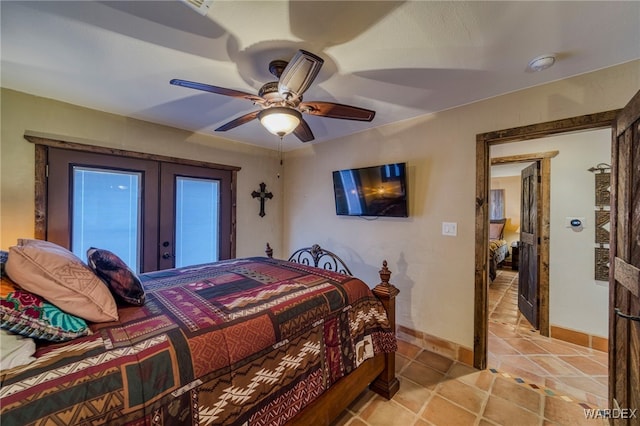 bedroom featuring french doors, ceiling fan, and baseboards