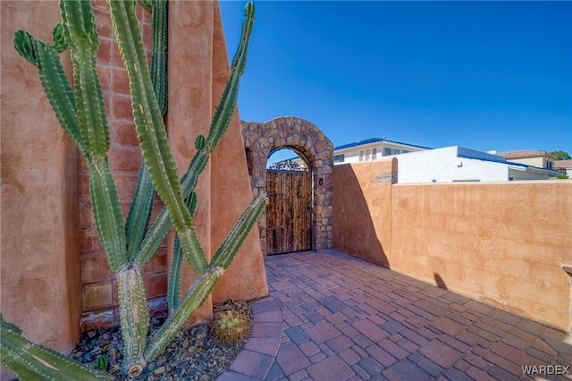 view of patio / terrace featuring a gate and fence