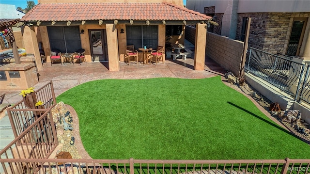 view of yard with a patio area and a fenced backyard