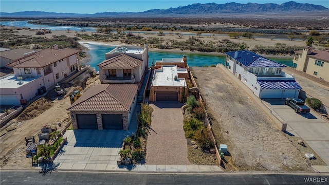 birds eye view of property with a mountain view