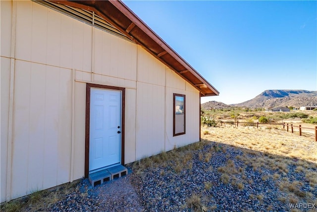 view of side of property with a mountain view