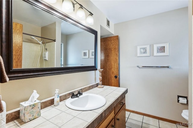 full bathroom with visible vents, toilet, tile patterned flooring, baseboards, and vanity