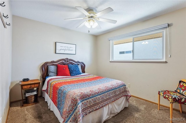 bedroom featuring baseboards, carpet floors, and a ceiling fan