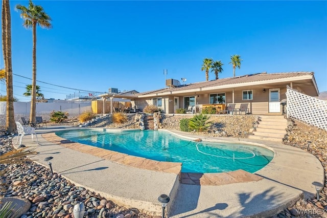 view of swimming pool with a fenced in pool, a patio, and fence