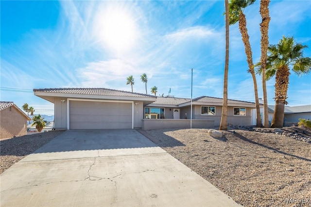 single story home with an attached garage and concrete driveway