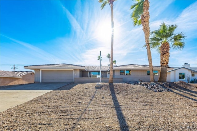 single story home with an attached garage and driveway