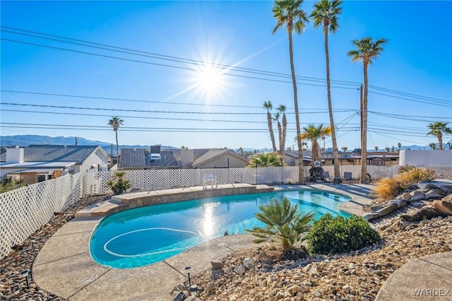 view of swimming pool with a fenced in pool and a fenced backyard