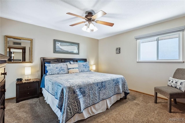 carpeted bedroom featuring baseboards and ceiling fan