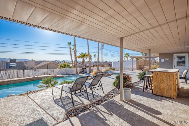 view of patio featuring a fenced in pool and a fenced backyard