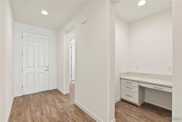 interior space with recessed lighting, light wood-style flooring, and baseboards