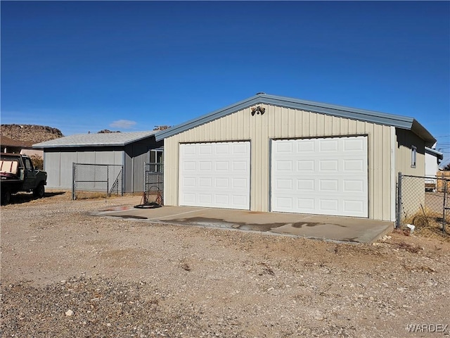 detached garage with fence