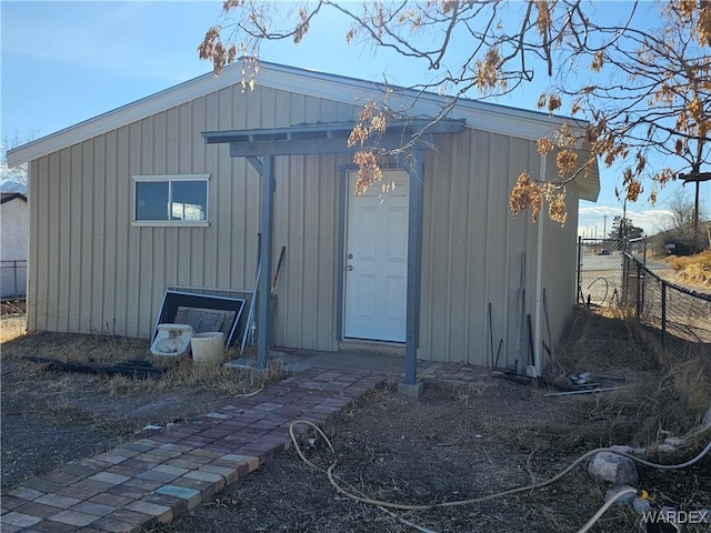 view of outbuilding with fence