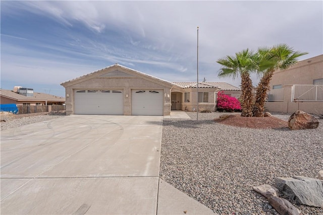 3103 Crater Dr, Lake Havasu, AZ 86404 - ranch-style home featuring driveway, a garage, a tile roof, and stucco siding