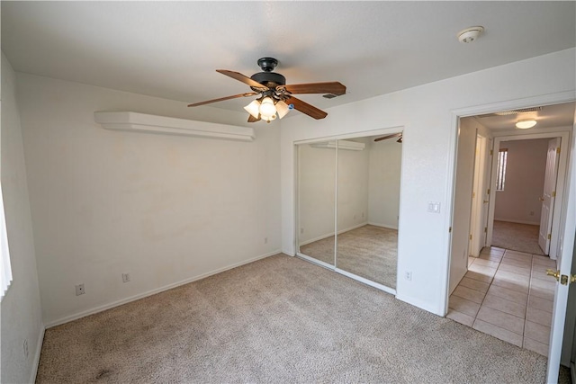 3103 Crater Dr, Lake Havasu, AZ 86404 - unfurnished bedroom featuring light colored carpet, a closet, a ceiling fan, and baseboards
