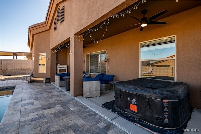 view of patio / terrace featuring fence, outdoor lounge area, and a ceiling fan