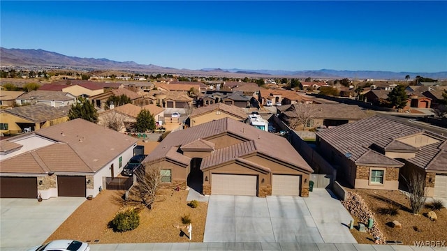 birds eye view of property with a mountain view and a residential view