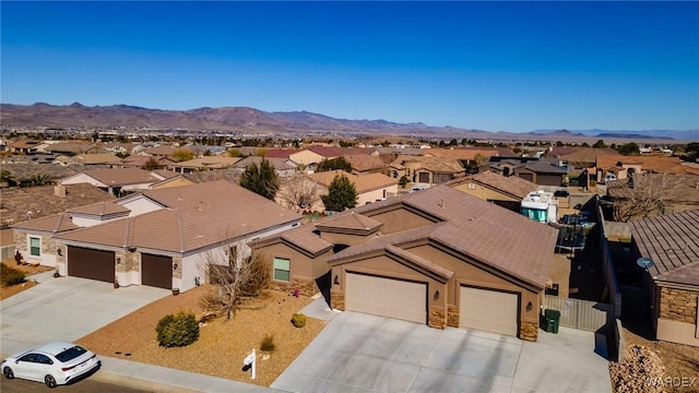 birds eye view of property featuring a residential view and a mountain view