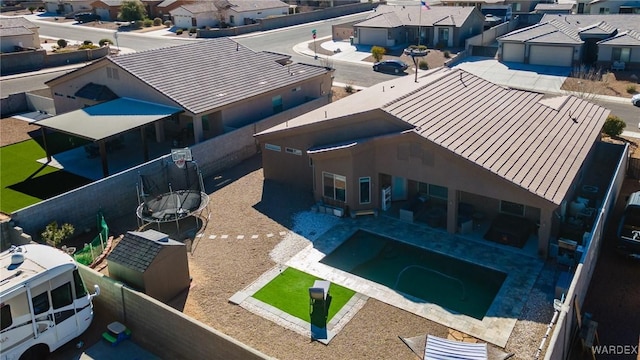 birds eye view of property with a residential view