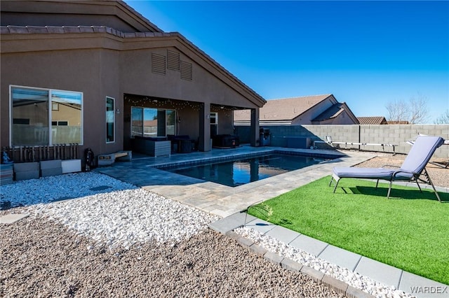 view of swimming pool featuring a fenced in pool, a fenced backyard, and a patio