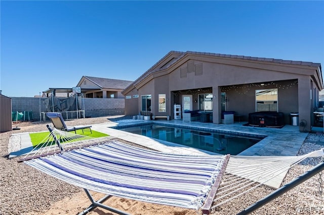 view of pool with a fenced in pool, a fenced backyard, a patio, and a trampoline