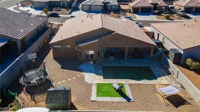 birds eye view of property with a residential view