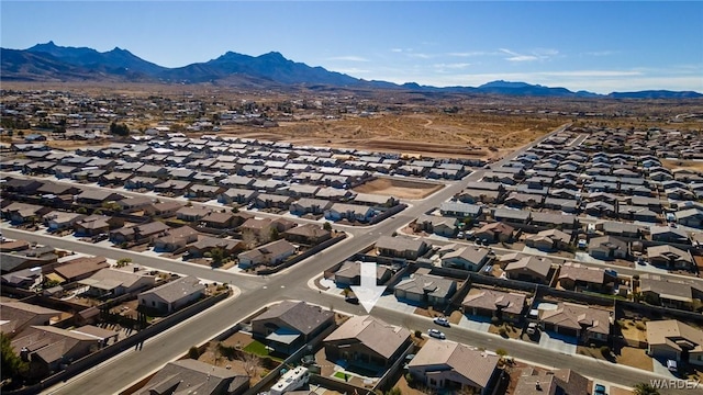 birds eye view of property with a mountain view and a residential view