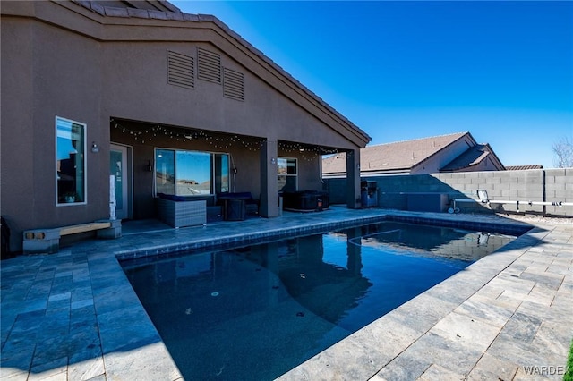 view of swimming pool featuring a fenced in pool, a fenced backyard, and a patio