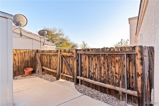 view of patio / terrace with fence and a gate