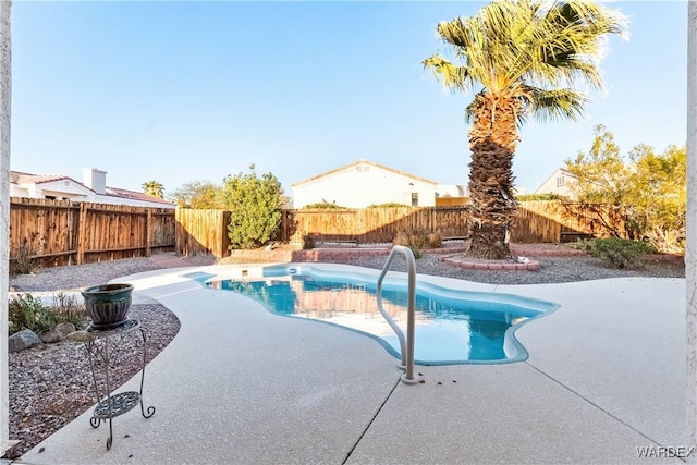 view of pool featuring a patio area, a fenced backyard, and a fenced in pool