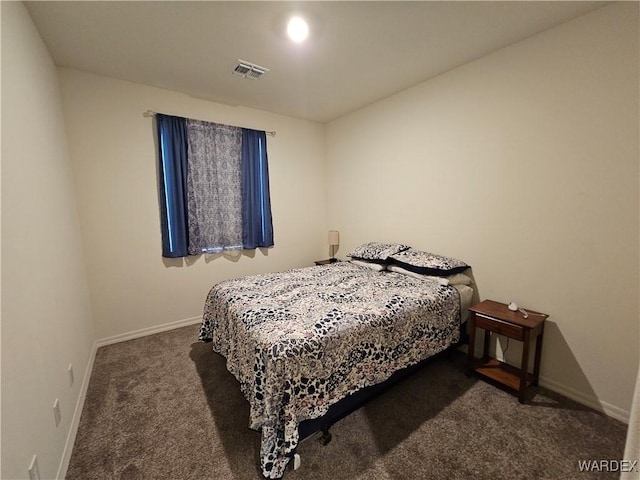 bedroom featuring dark carpet, visible vents, and baseboards