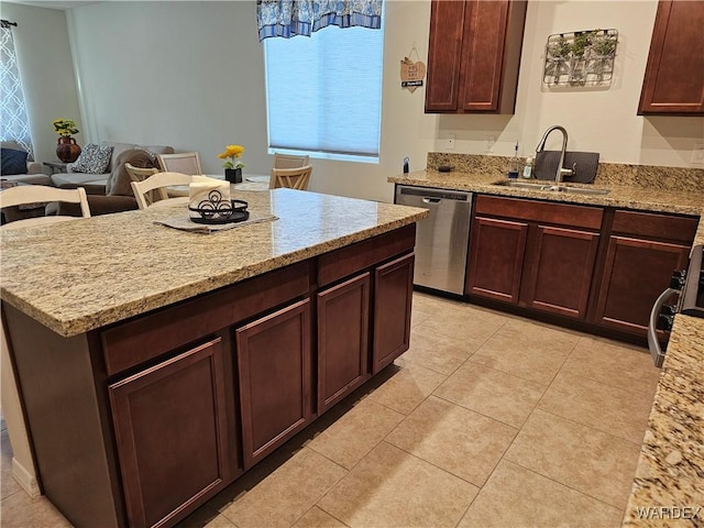 kitchen featuring a sink, light tile patterned floors, light stone counters, and dishwasher