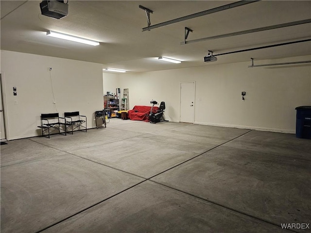 garage featuring a garage door opener