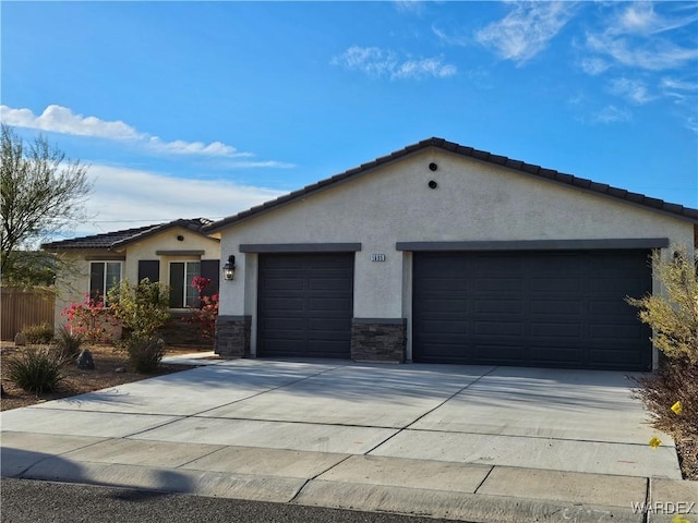 ranch-style house featuring a garage, stone siding, driveway, and stucco siding