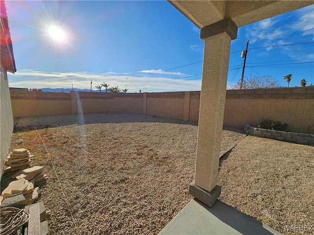 view of yard with a fenced backyard