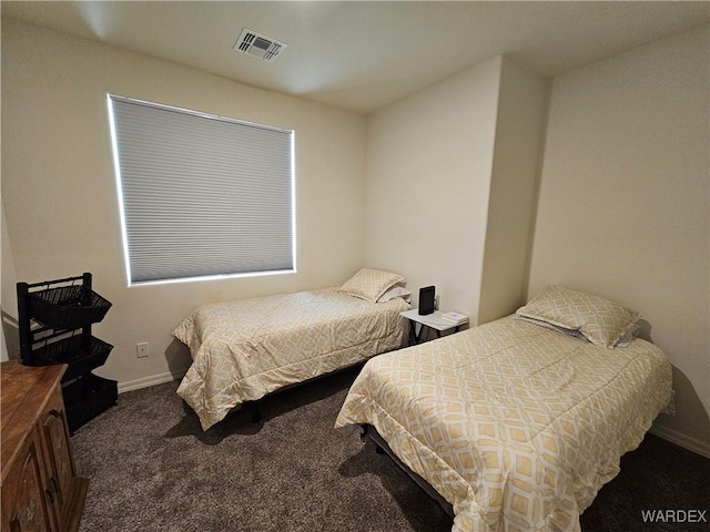 carpeted bedroom with baseboards and visible vents