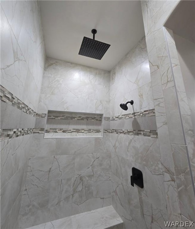 full bathroom with tiled shower